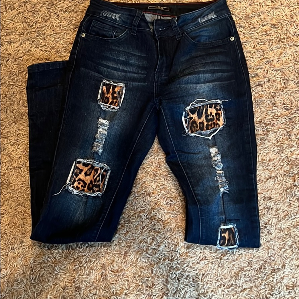 Denim and cheetah distressed skinny jeans